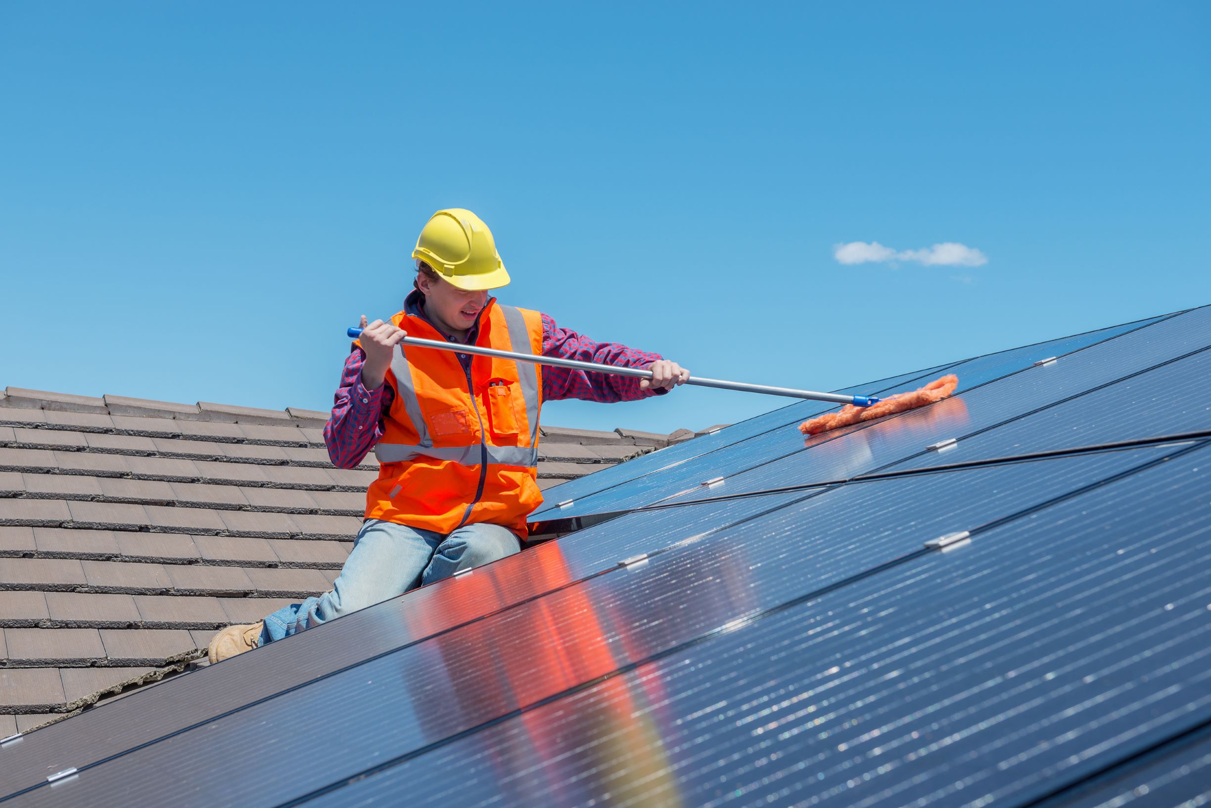 Cleaning solar panels with a soft mop