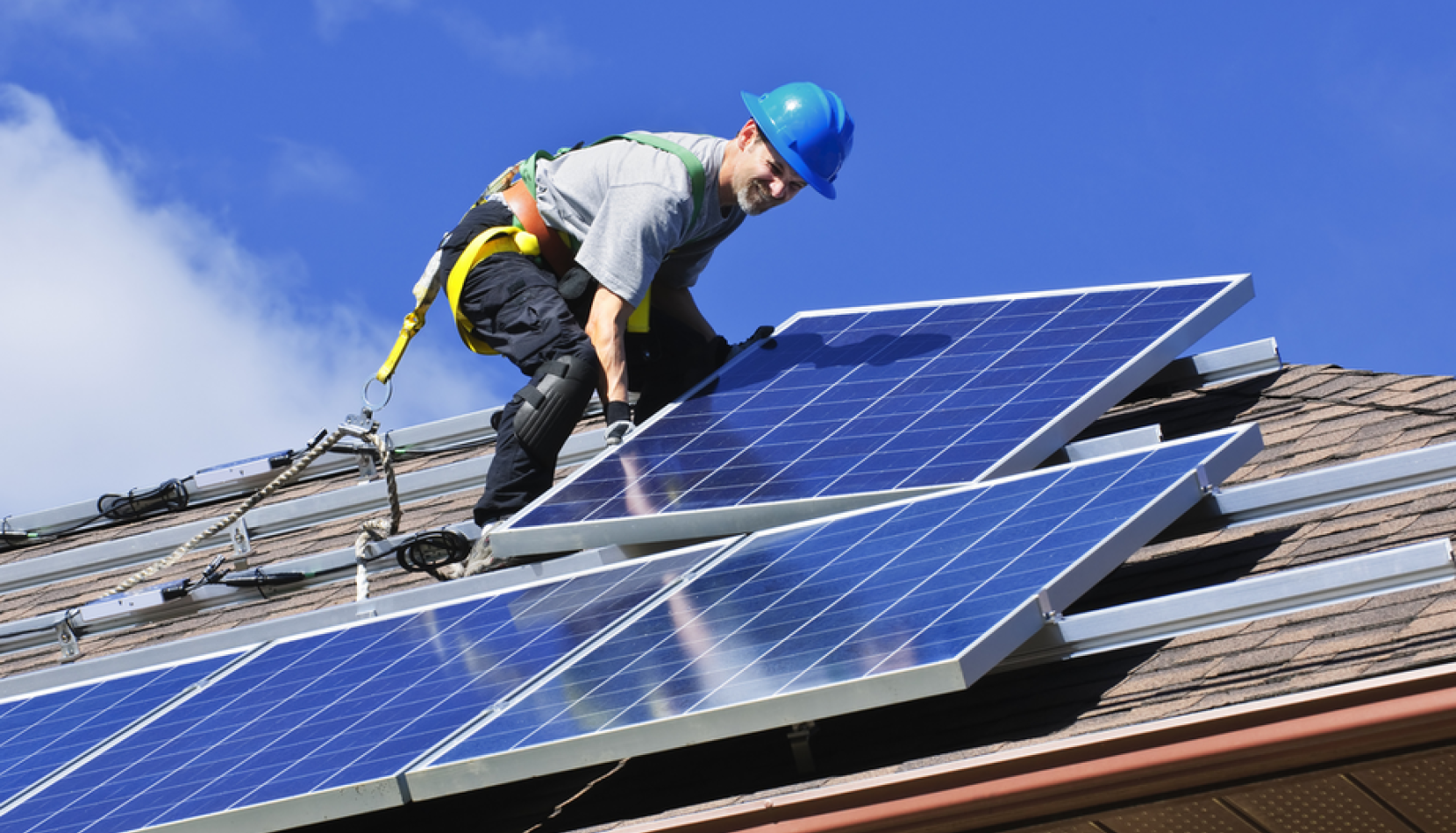 Solar System and Solar Panels Being Installed to Save on Electricity Costs